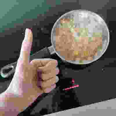 A low-quality photo of a pot of boiling pasta, the webmaster's hand is giving it a thumbs-up.